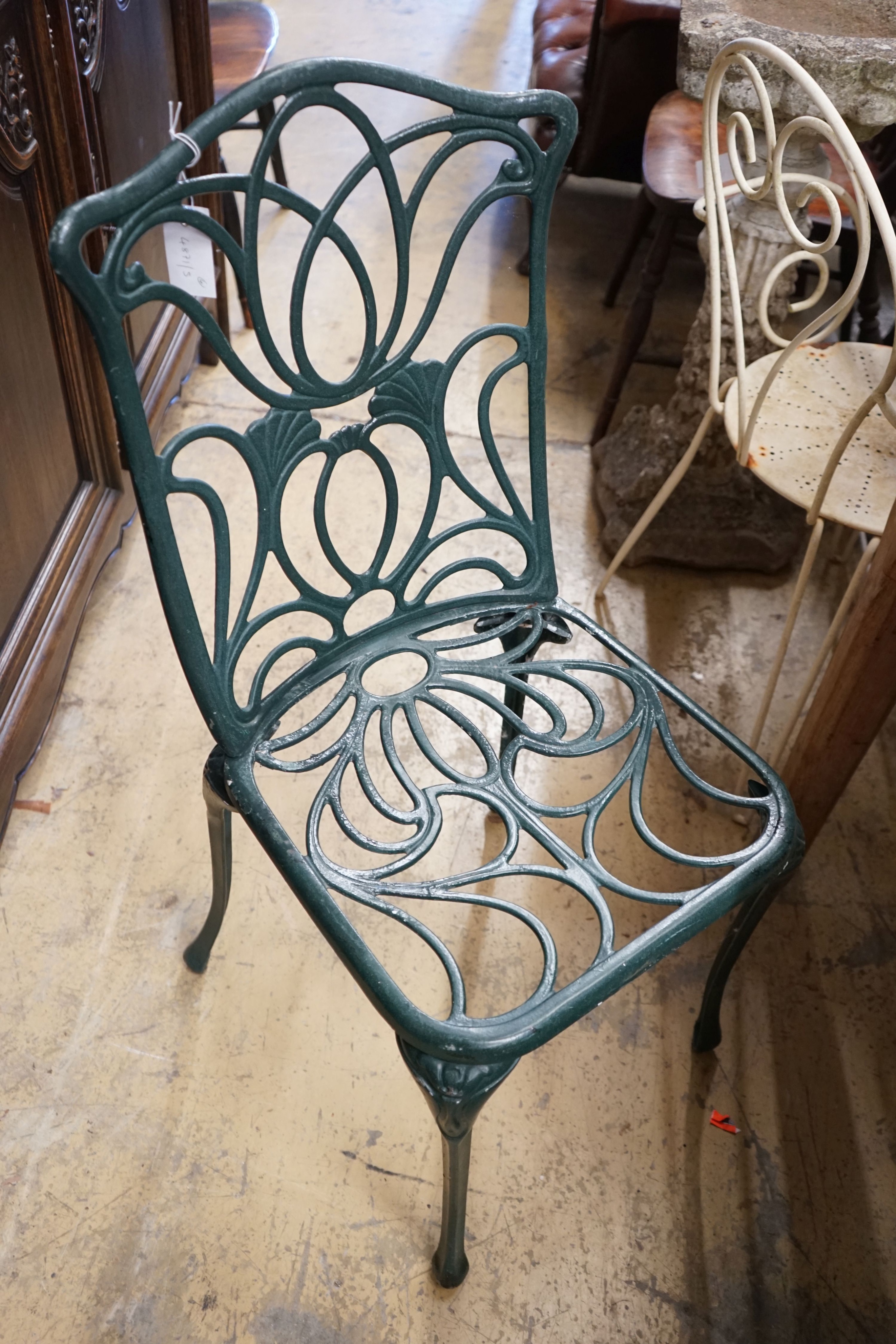 A set of four painted aluminium garden chairs